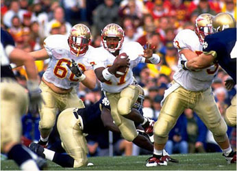 Charlie Ward scrambles